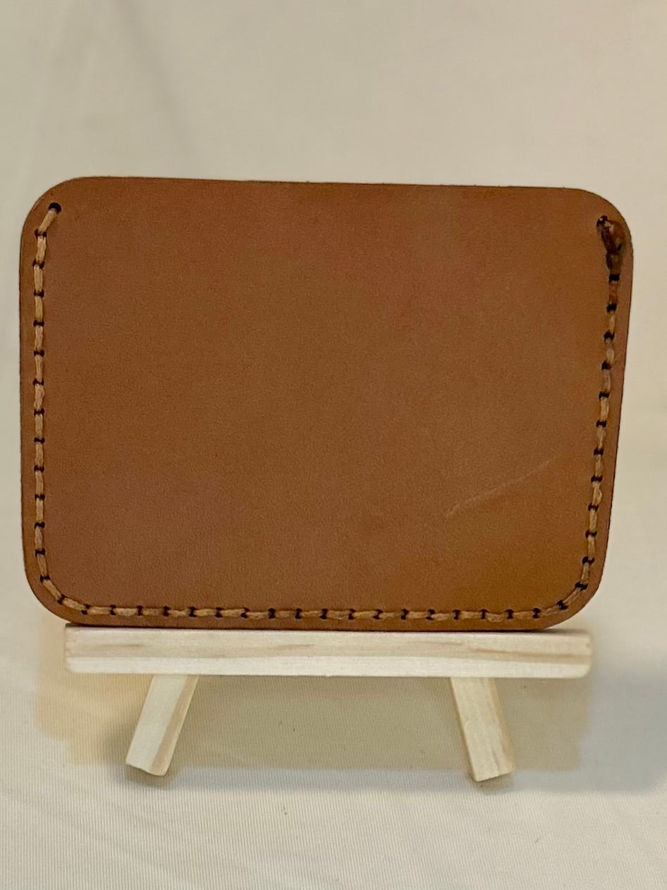 Back of a tan card holder with tan stitching 